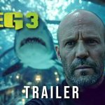 Official trailer thumbnail for The Meg 3 featuring a close-up of Jason Statham with a giant Megalodon shark behind him in an underwater tunnel.